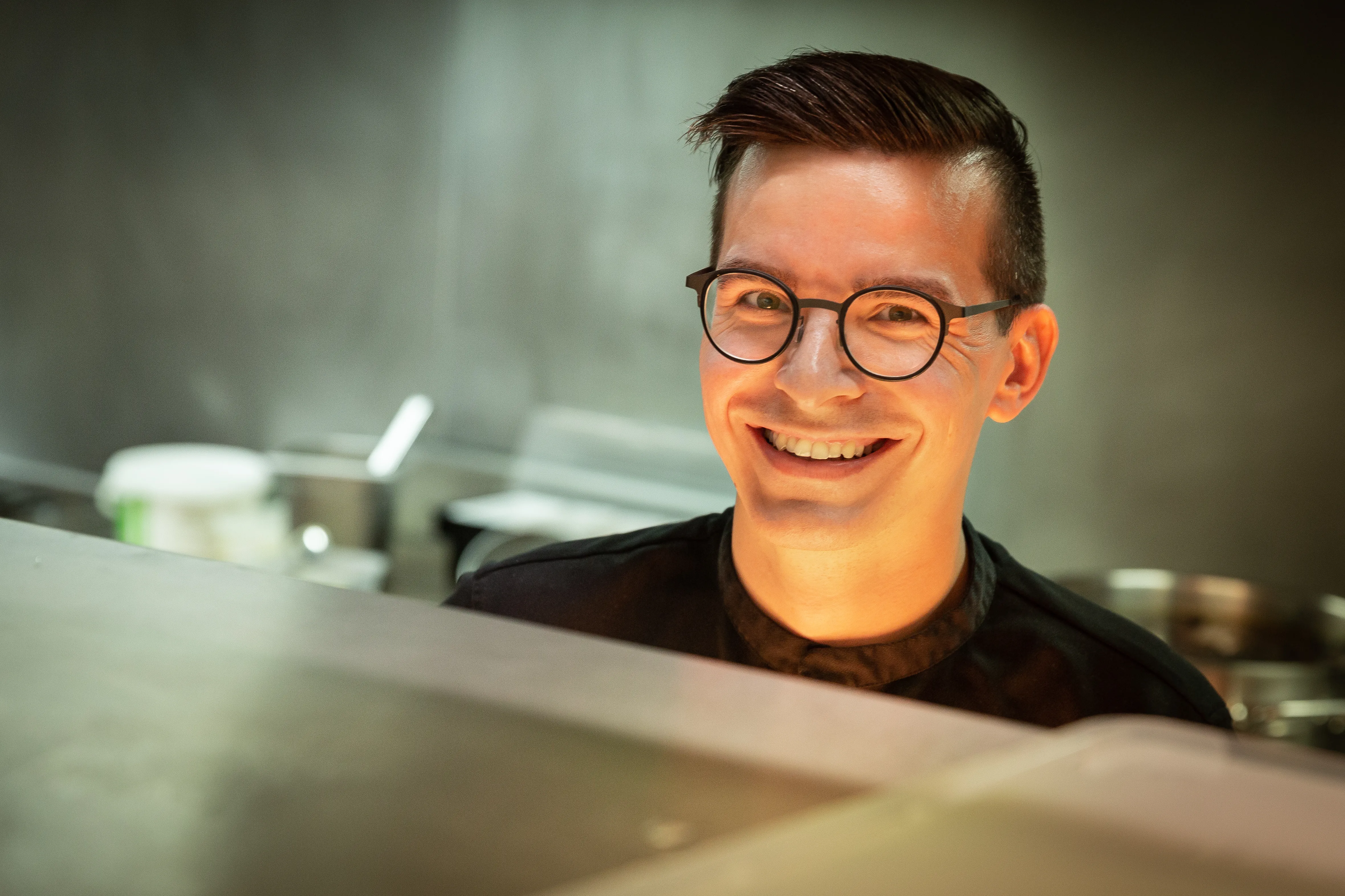 Christophe Prosperi smiling in the kitchen