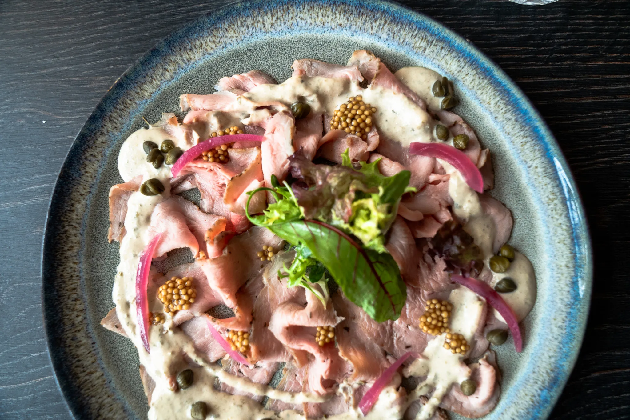 Roast beef carpaccio with capers and mustard seed