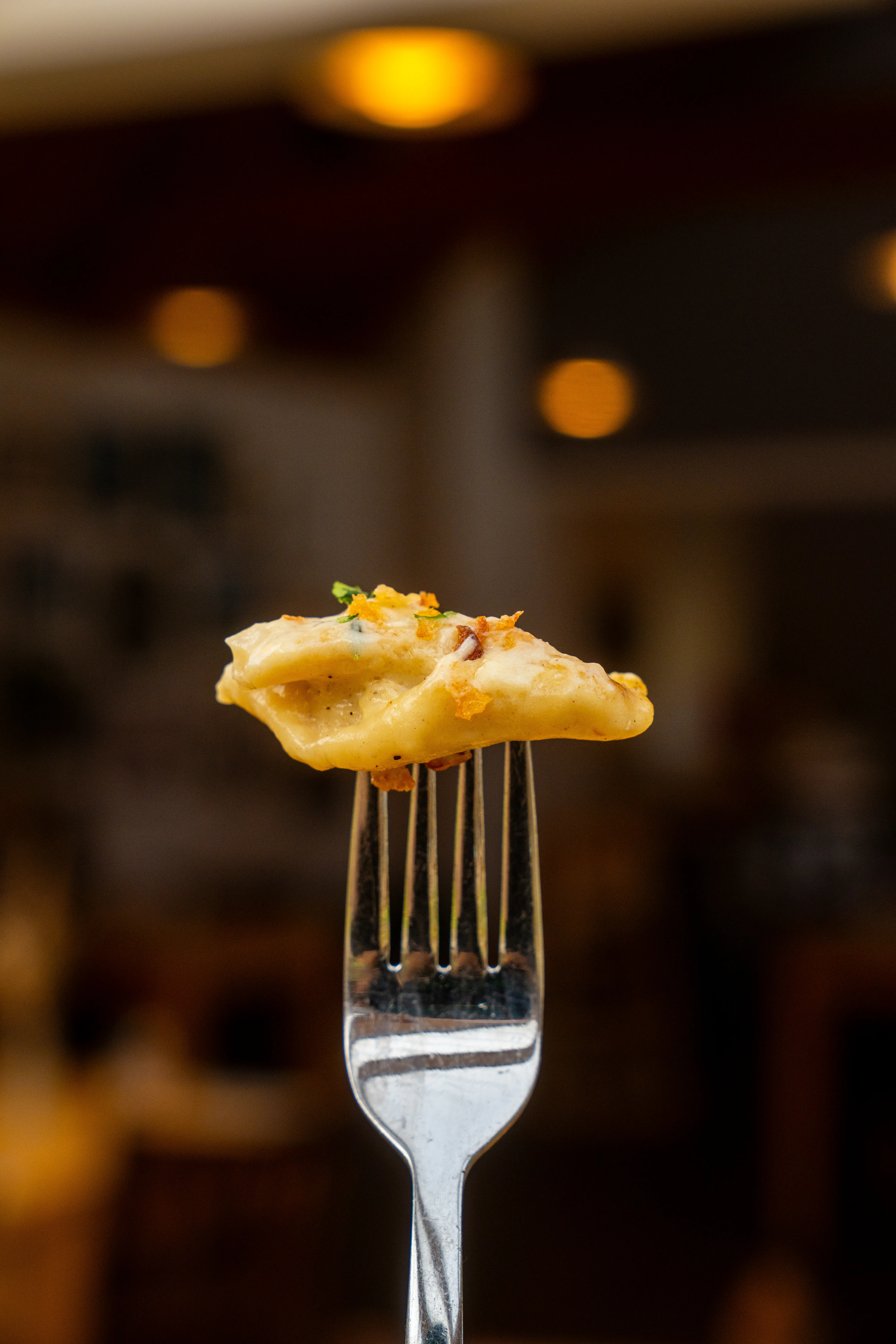 Cheese ravioli on a fork