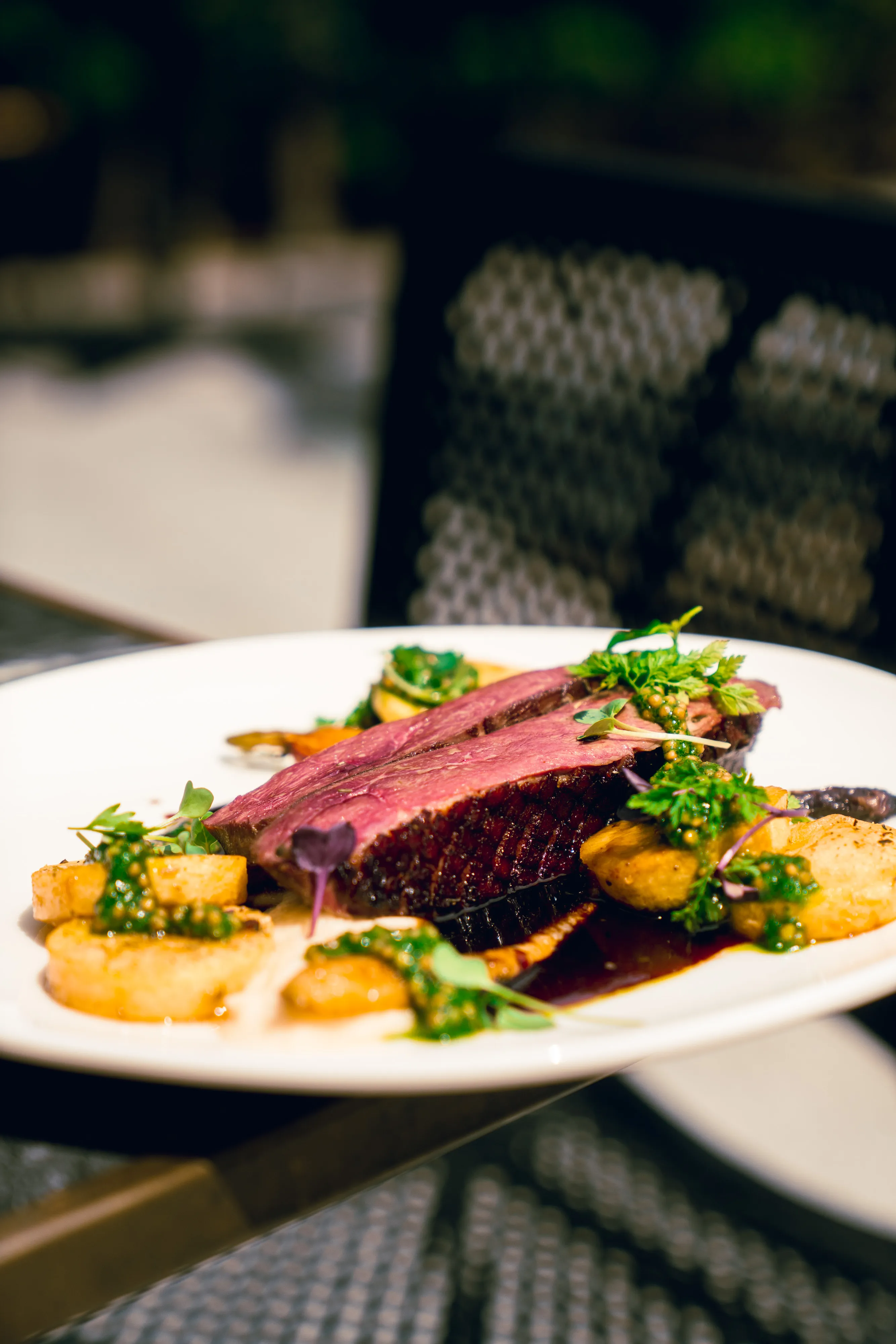 Sliced duck breast with roasted potatoes