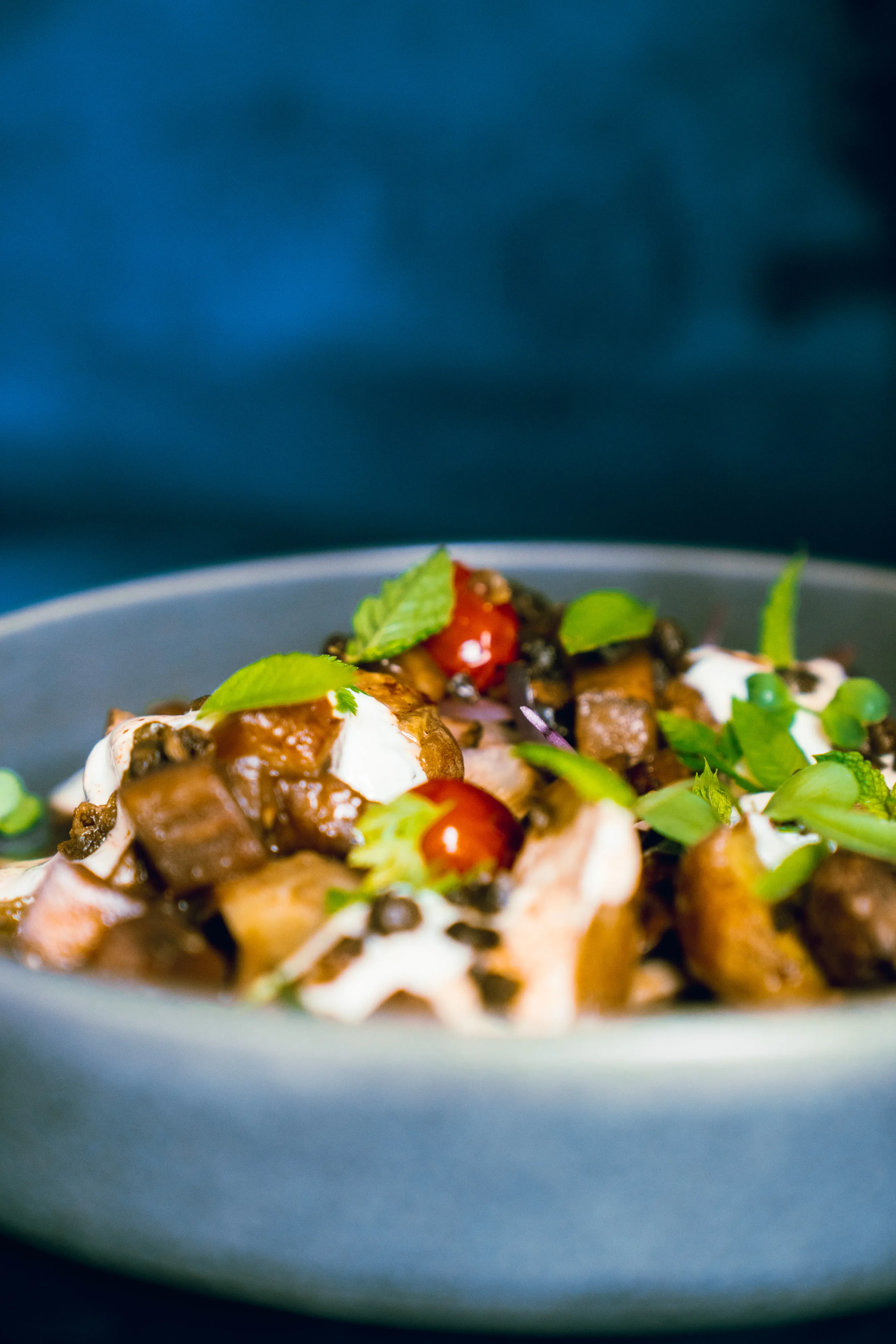Warm potato and aubergine salad with herbs