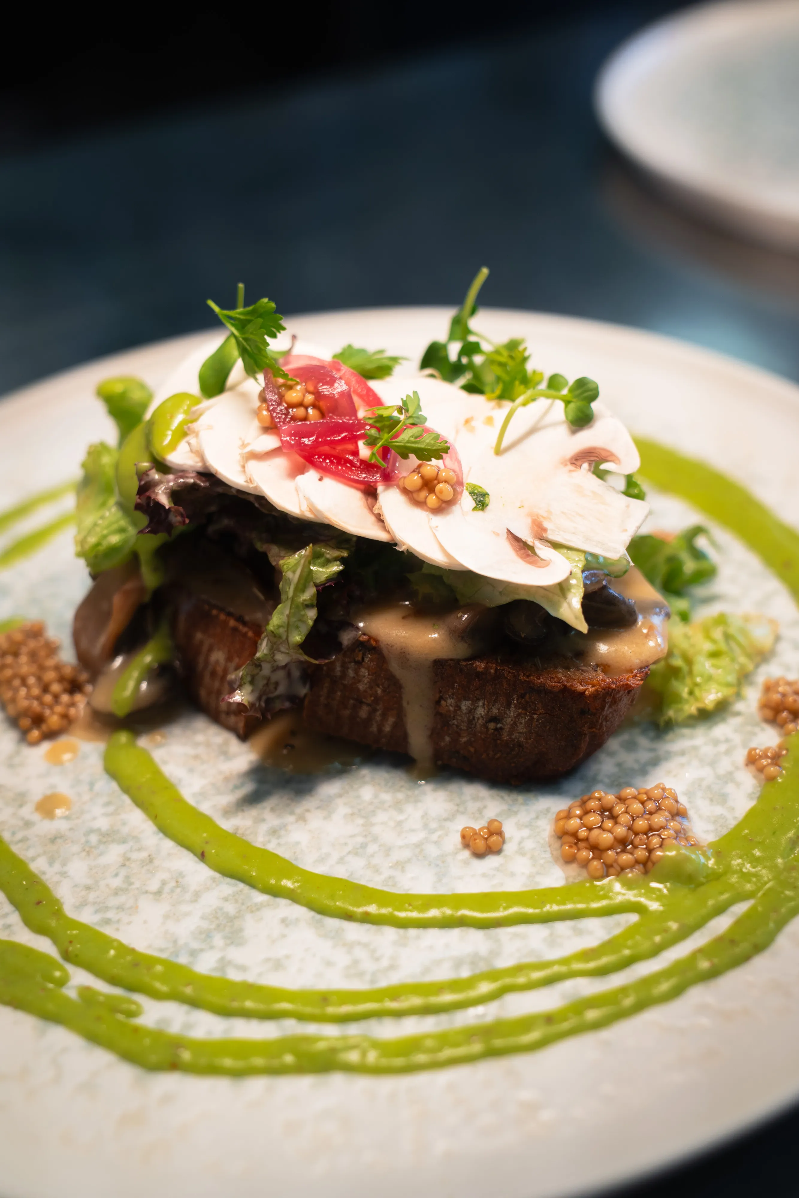 Open-faced toast with mushroom and pickled onion