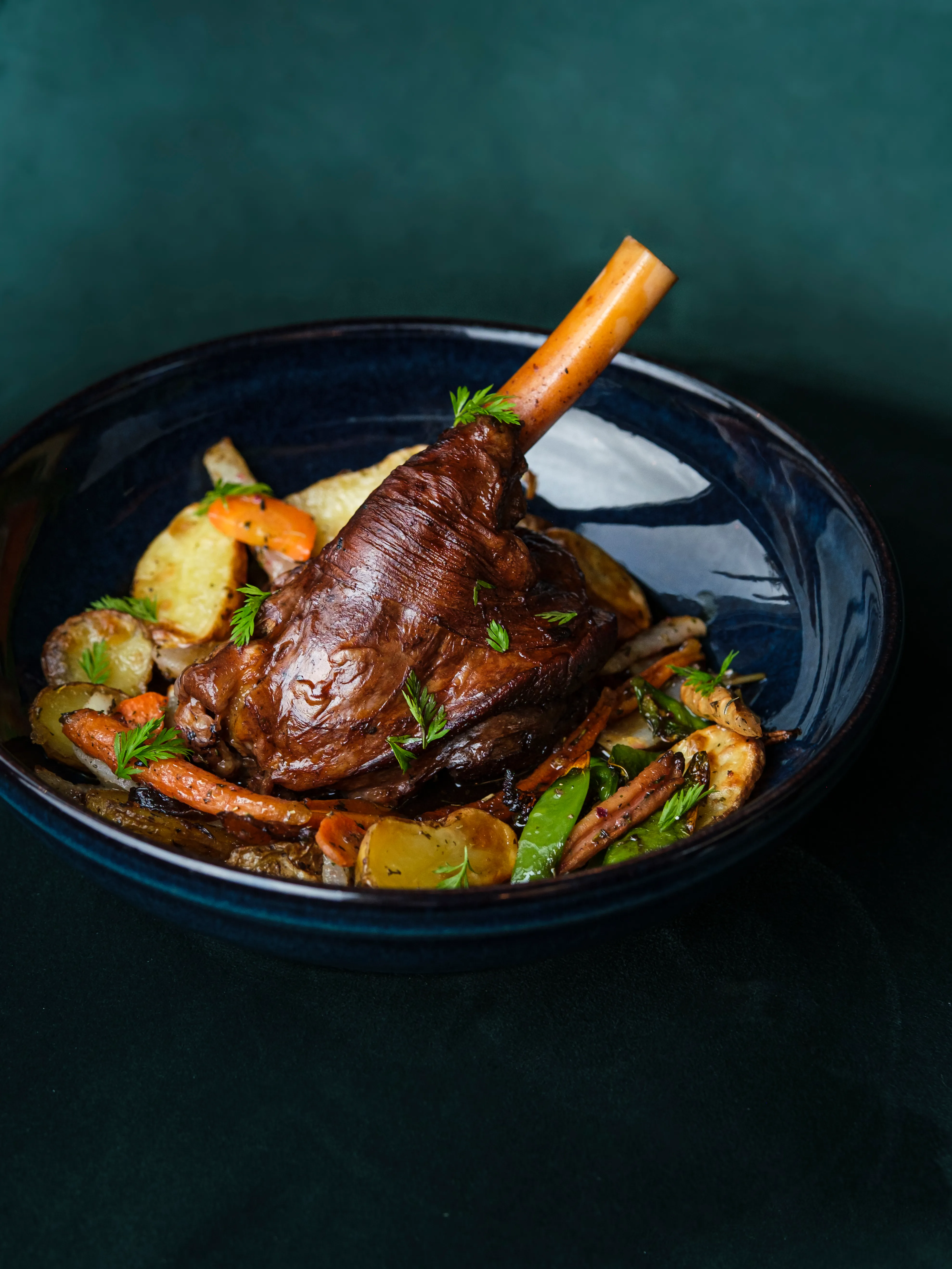 Braised lamb shank with roasted root vegetables