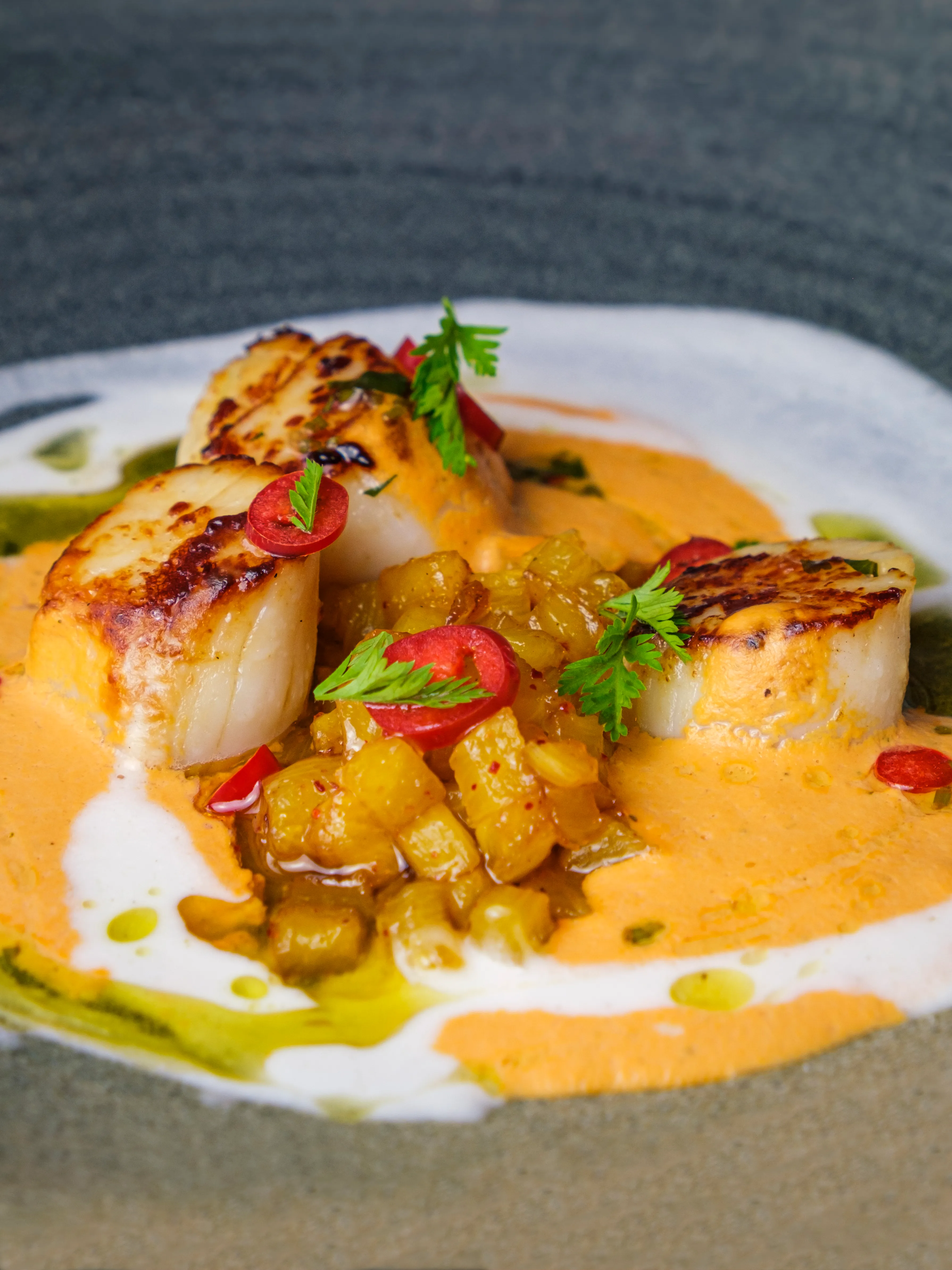 Seared scallops with romesco and chili